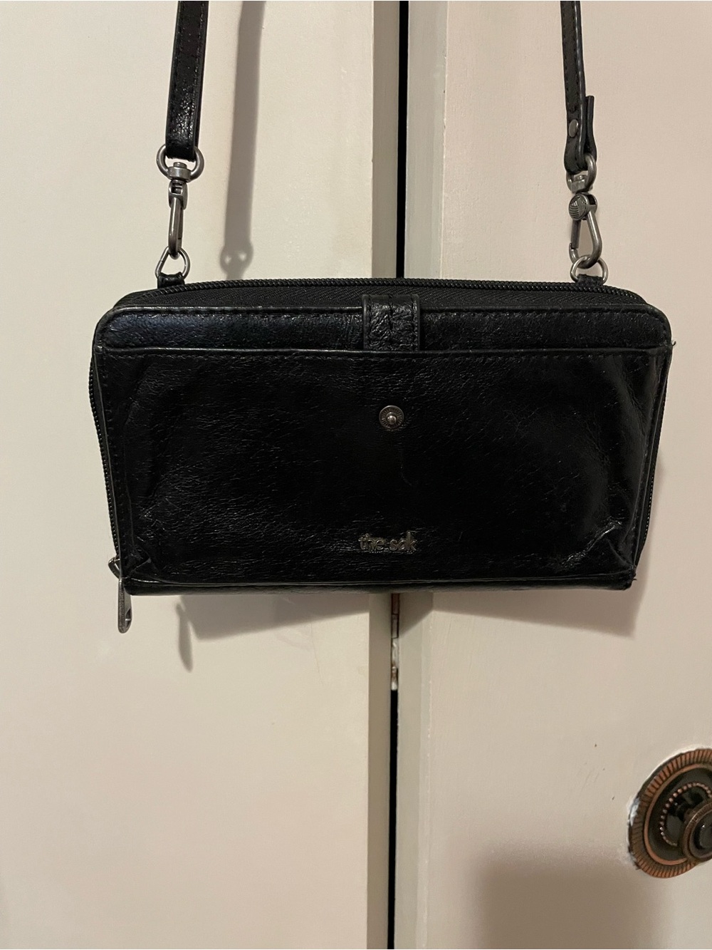 The Sak Ladies Sleek Black Leather Crossbody Wallet